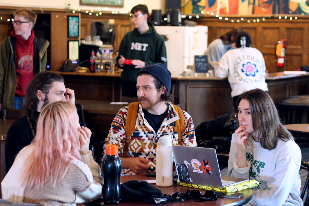 A group of students sitting around a table in Blaurock Cafe